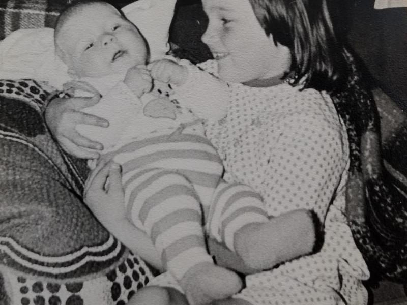 This is me as a 7-year-old, holding a baby. This baby appeared to be the dad of one of my pupils in this class!